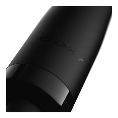Doxy Original Plug-In Wand Massager Black Close-up of a black cylindrical product, showing the embossed brand name 'DOXY' on a clean white background - Adult Toys - Wands - Danish Blue Adult Centres
